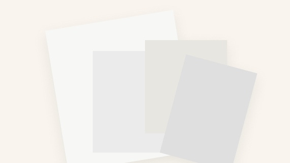 Printed artwork thumbnails arranged in different sequences on a light studio surface, illustrating how artists structure the visual flow of a portfolio.