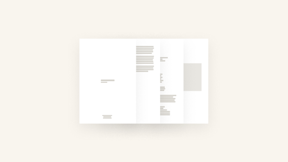 Artist portfolio documents laid out on a table ready for a residency application